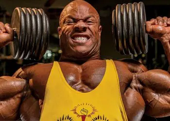 The Standing vs Seated Overhead Press: Which Builds More Muscle?