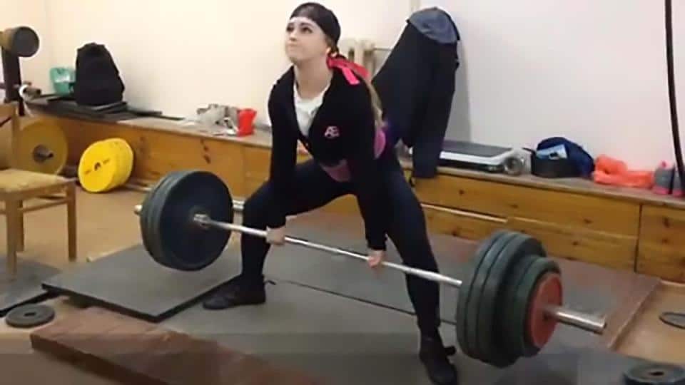 Julia is seen weighlifting in the gym