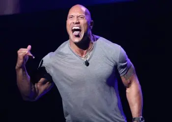 Dwayne Johnson Kicks It Back To The ’90s When He Had A Flattop, Turtleneck & Fanny Pack