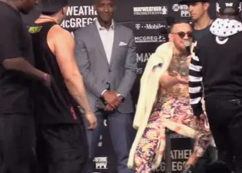 Floyd Mayweather surround Conor McGregor