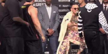 Floyd Mayweather surround Conor McGregor