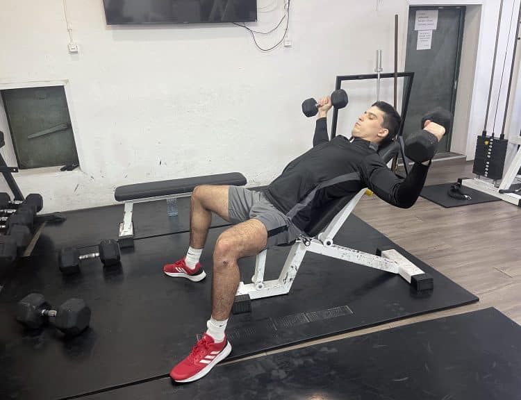 Vanja Vukas Showing Dumbbell Incline Fly Eccentric Position