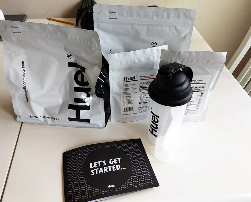 Huel Starter Kit - Includes 2 nutritionally complete 100% vegan powder meal packets, spoon, shaker and booklet