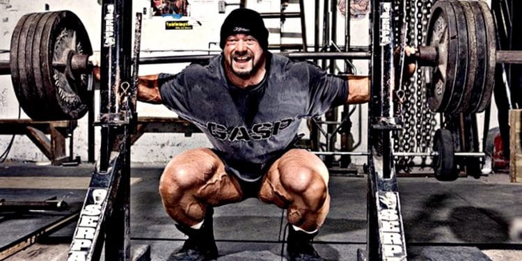 Lifter controls the bottom position of a barbell back squat