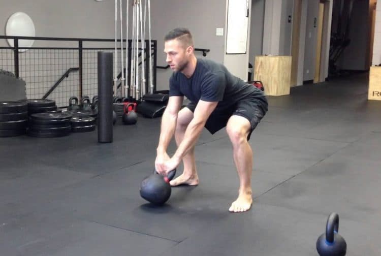 Kettlebell Swings With The Weight Resting On The Floor