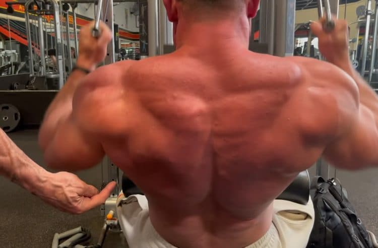 Long Bar Pulldown In Back Double Biceps Pose
