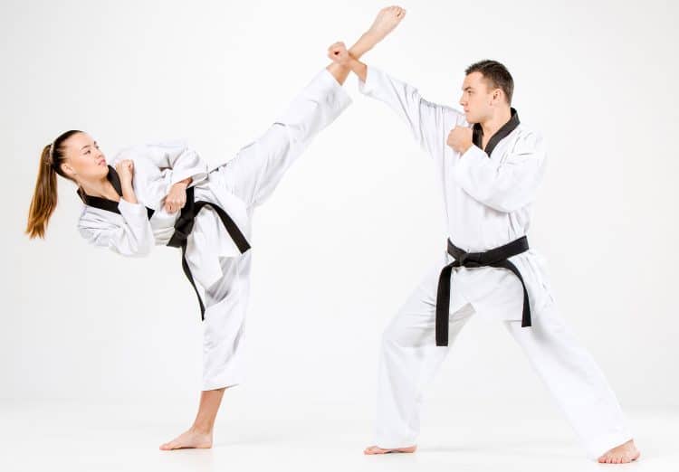 Karate Girl And Boy With Black Belts
