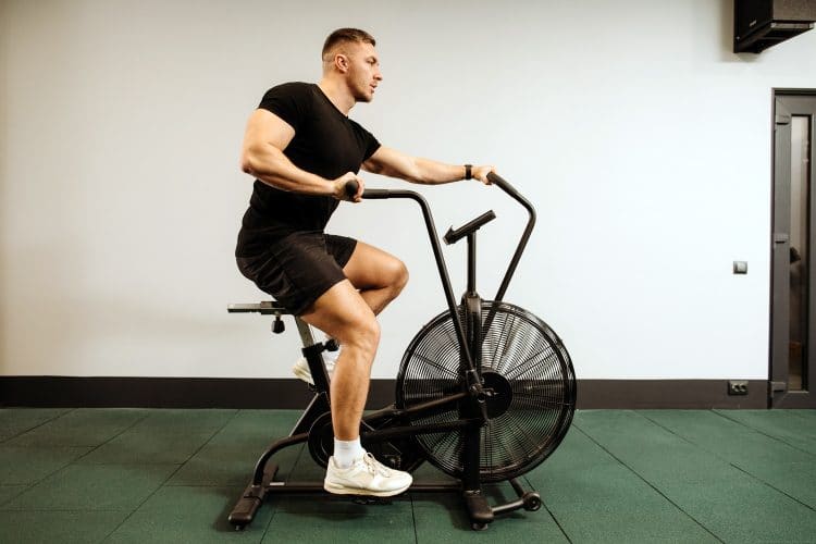 Man Using Air Bike For Cardio