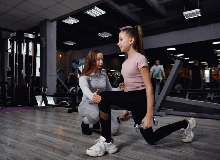 Teen Girl Lunges With Trainer