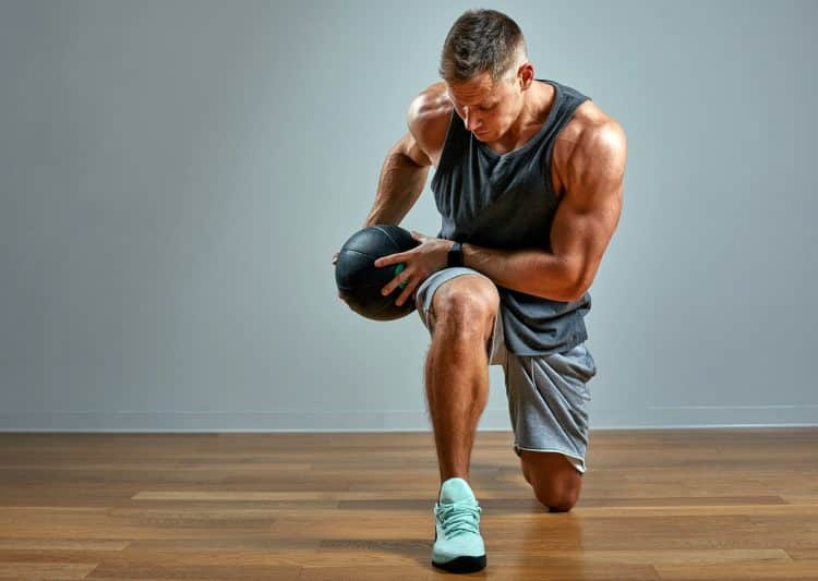 Man Doing Exercise With Med Ball