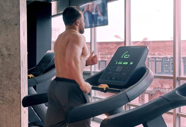 Bodybuilder Running on The Treadmill
