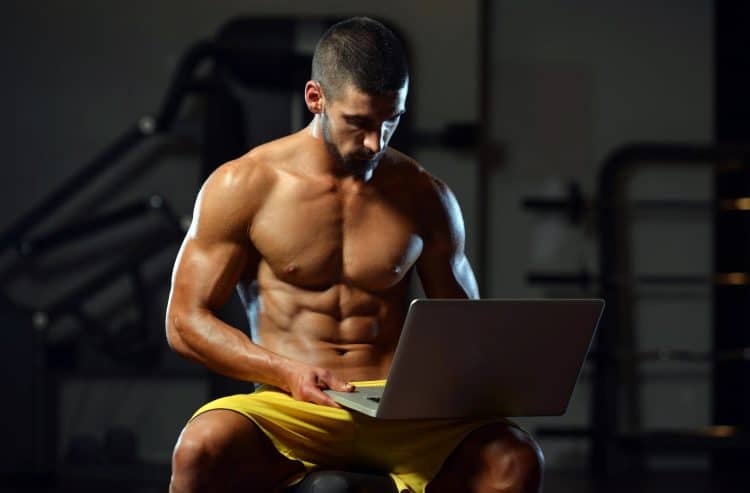 Bodybuilder Using Computer
