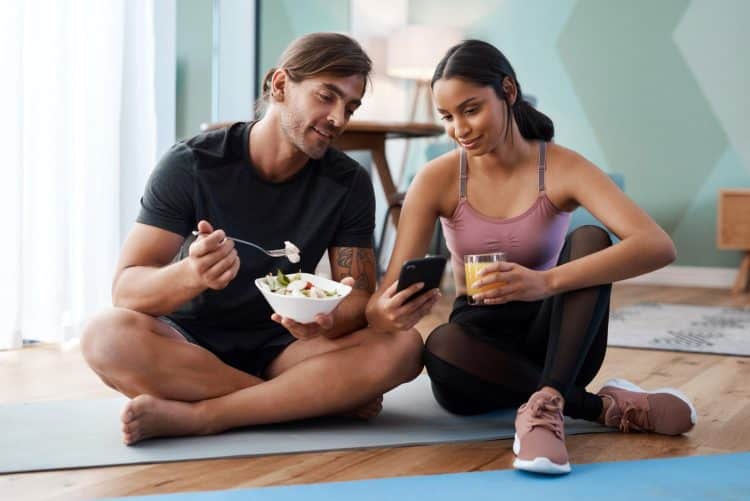 Athletic Young Couple Eating Healthy Food
