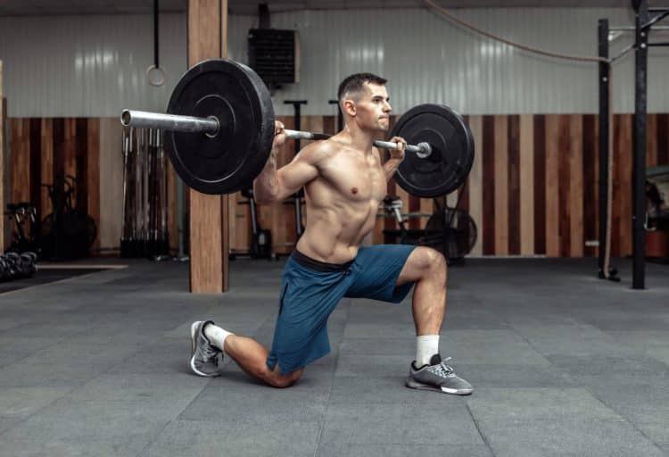 Bodybuilder Doing Lunges With A Barbell