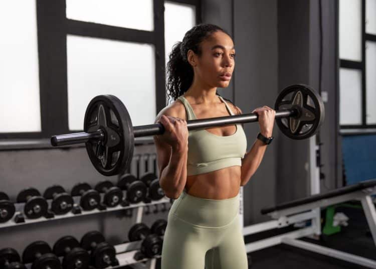 Woman Doing Barbell Curls