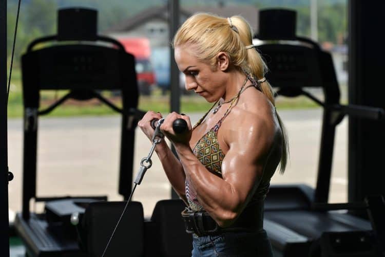 Female Bodybuilder Doing Biceps Exercise