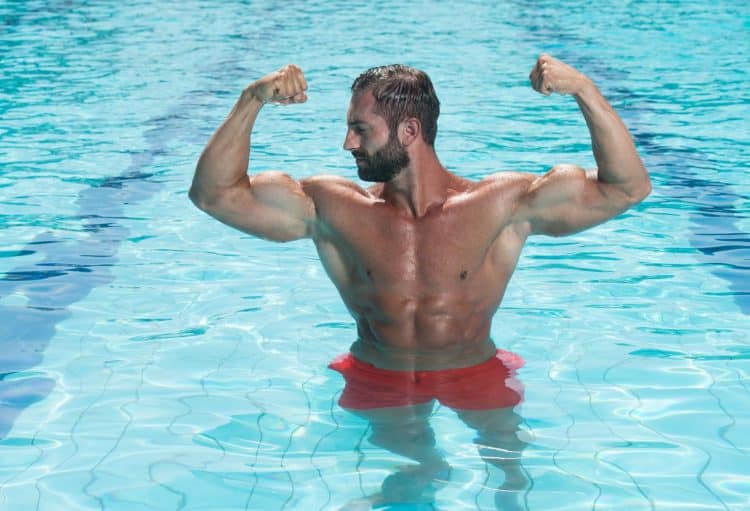 Muscular Man Posing In Pool