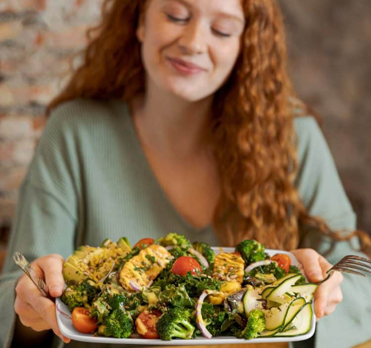 Woman Holding Plate With Healthy Food