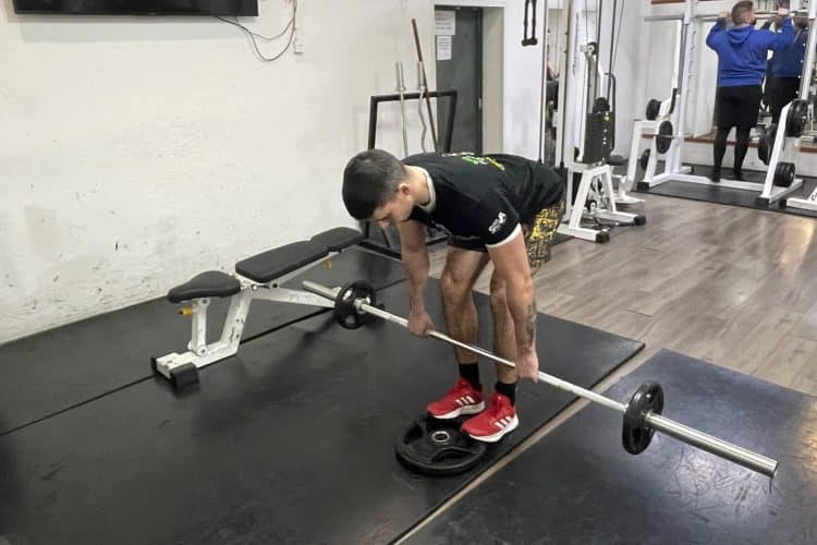 Elevated Romanian Deadlift Lower The Barbell Below Your Knees