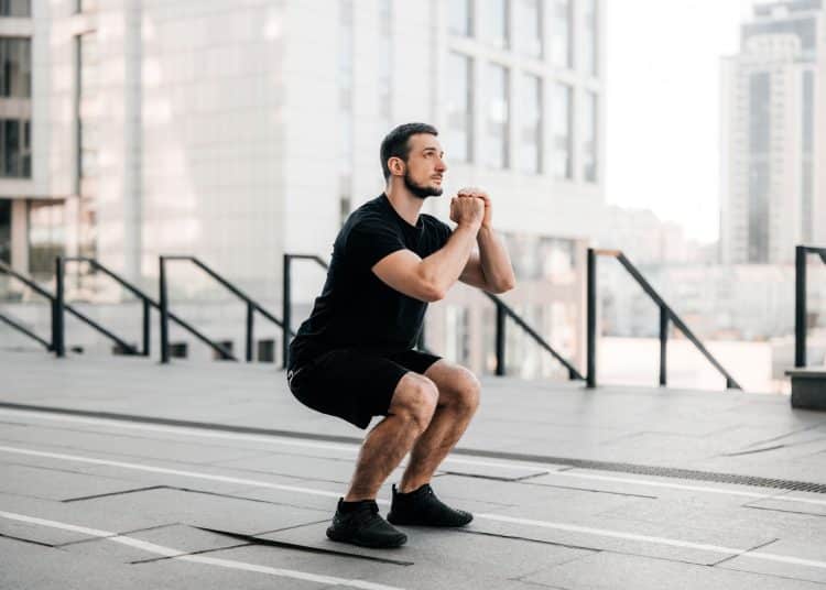 Man Training Air Squat Exercise