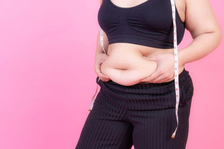 Woman Squeeze Belly Fat