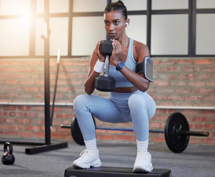 Woman Doing Dumbbell Squat