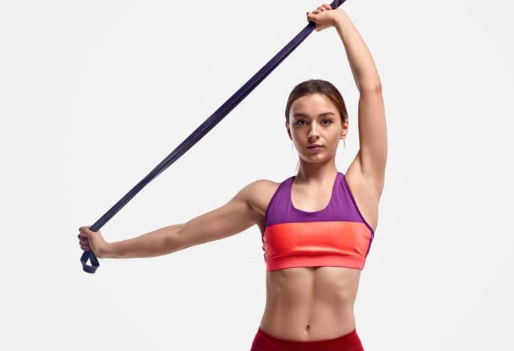 Girl Exercising With Resistance Band