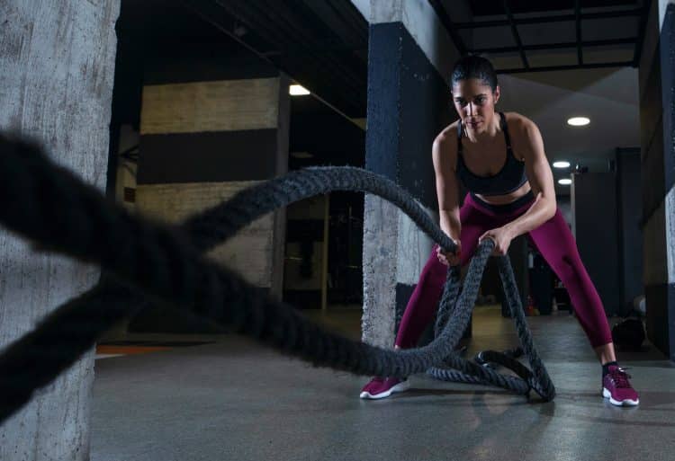 Woman Working Out With Battle Ropes