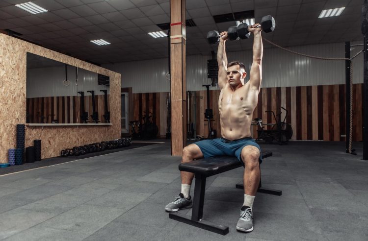 Man Doing Seated Dumbbell Press