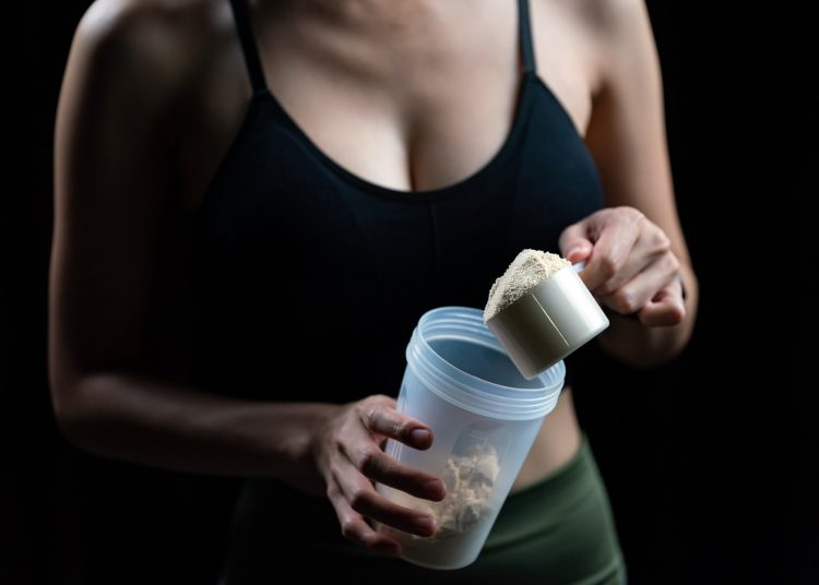 Scoop of Whey Protein And Shaker Bottle