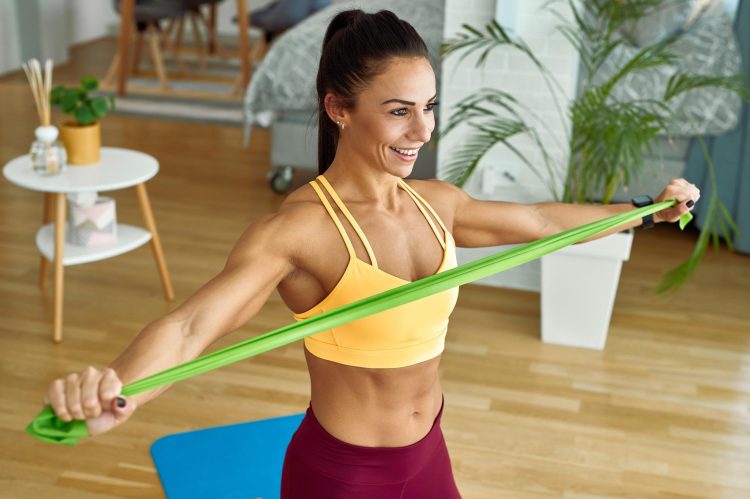 Woman Exercising With Resistance Band