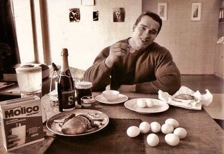 Arnold Eating High Protein Meal