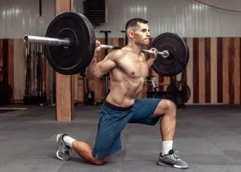 Bodybuilder Doing Barbell Lunges