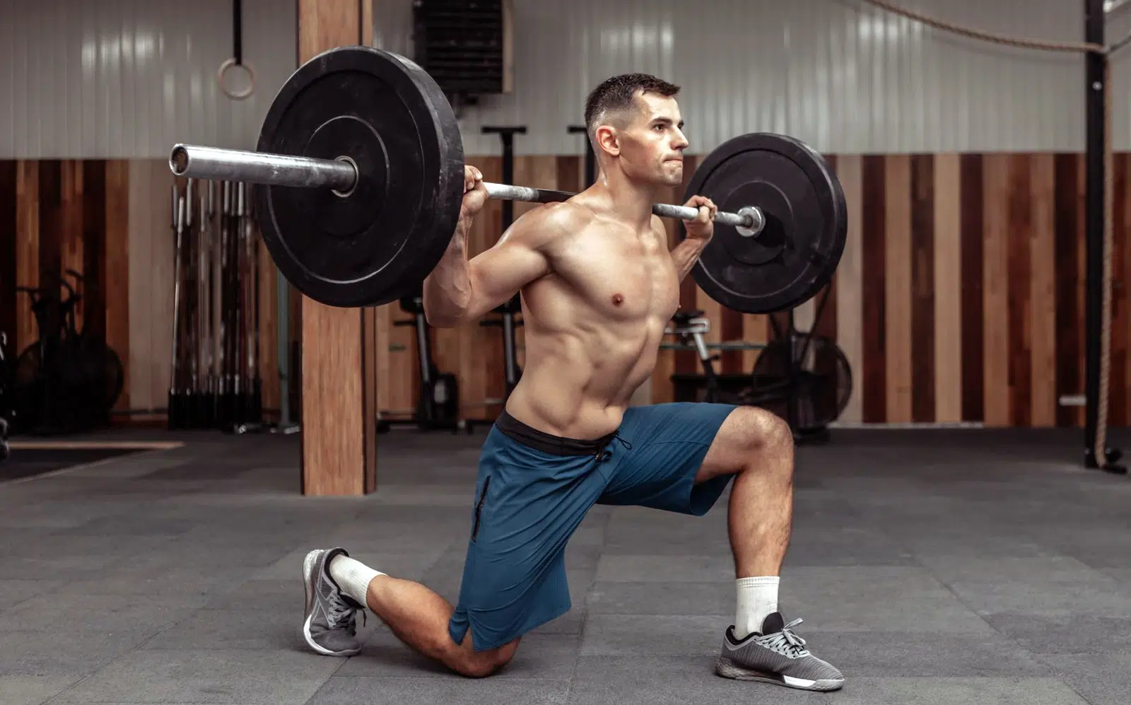 Bodybuilder Doing Barbell Lunges