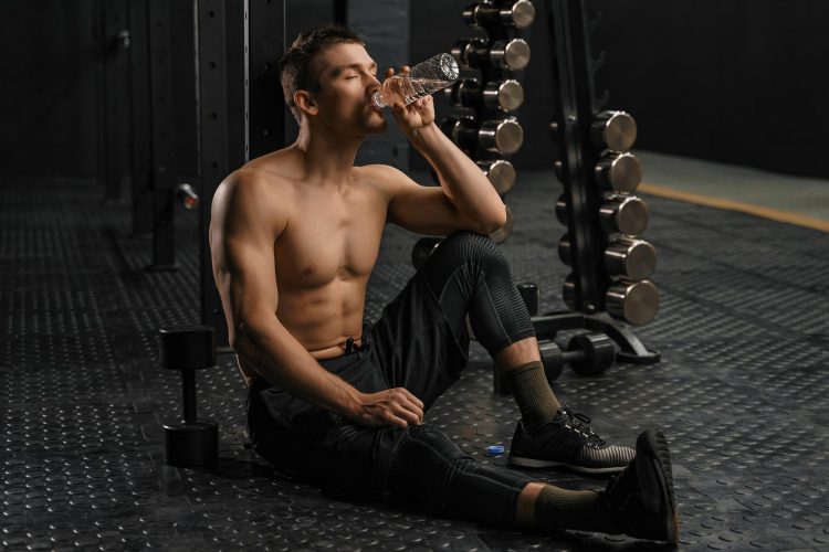 Man Drinking Water After Workout Man Drinking Water After Workout