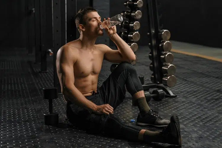 Man Drinking Water After Workout