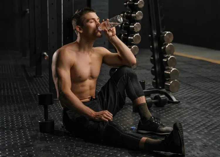 Man Drinking Water After Workout