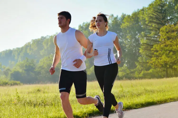 Couple Jogging In Park