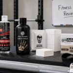 Real reviewed lifting chalk products arranged in a FitnessVolt gym review setup