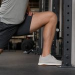 The knee-to-wall test helps lifters check ankle mobility before changing squat stance or shoes.