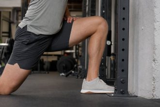 The knee-to-wall test helps lifters check ankle mobility before changing squat stance or shoes.
