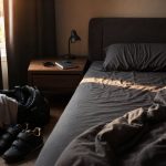 Bedroom with gym bag, lifting shoes, and sleep tracker for sleep and testosterone recovery