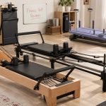 Pilates reformers arranged in a FitnessVolt home studio review scene