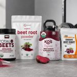 Beet root powder tubs on a gym counter