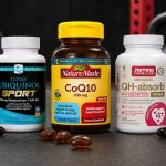 CoQ10 supplement bottles and softgels arranged for comparison