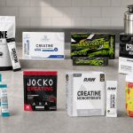 Single-serve creatine stick packs arranged beside a gym bag and water bottle