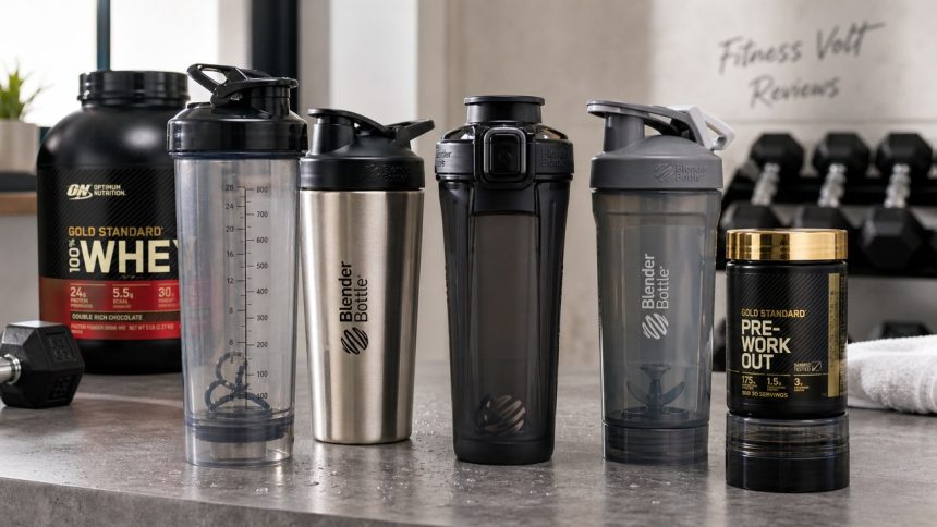 Protein shaker bottles arranged with protein powder and gym accessories for a FitnessVolt review