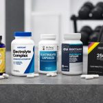 Electrolyte capsule bottles beside training gear