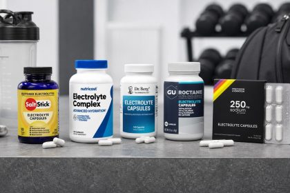 Electrolyte capsule bottles beside training gear