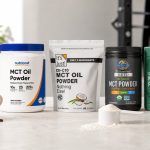 MCT oil powder tubs beside coffee and training gear